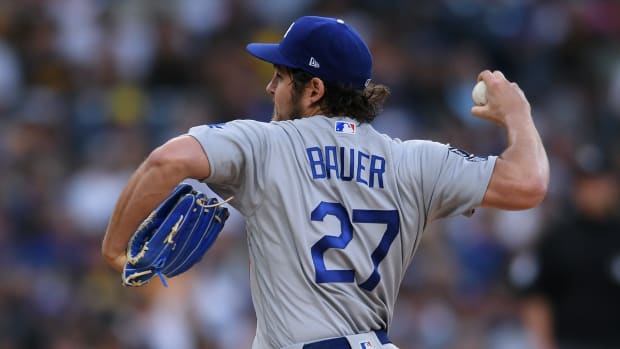 Jun 23, 2021; San Diego, California, USA; Los Angeles Dodgers starting pitcher Trevor Bauer (27) throws a pitch against the San Diego Padres during the first inning at Petco Park. Mandatory Credit: Orlando Ramirez-USA TODAY Sports